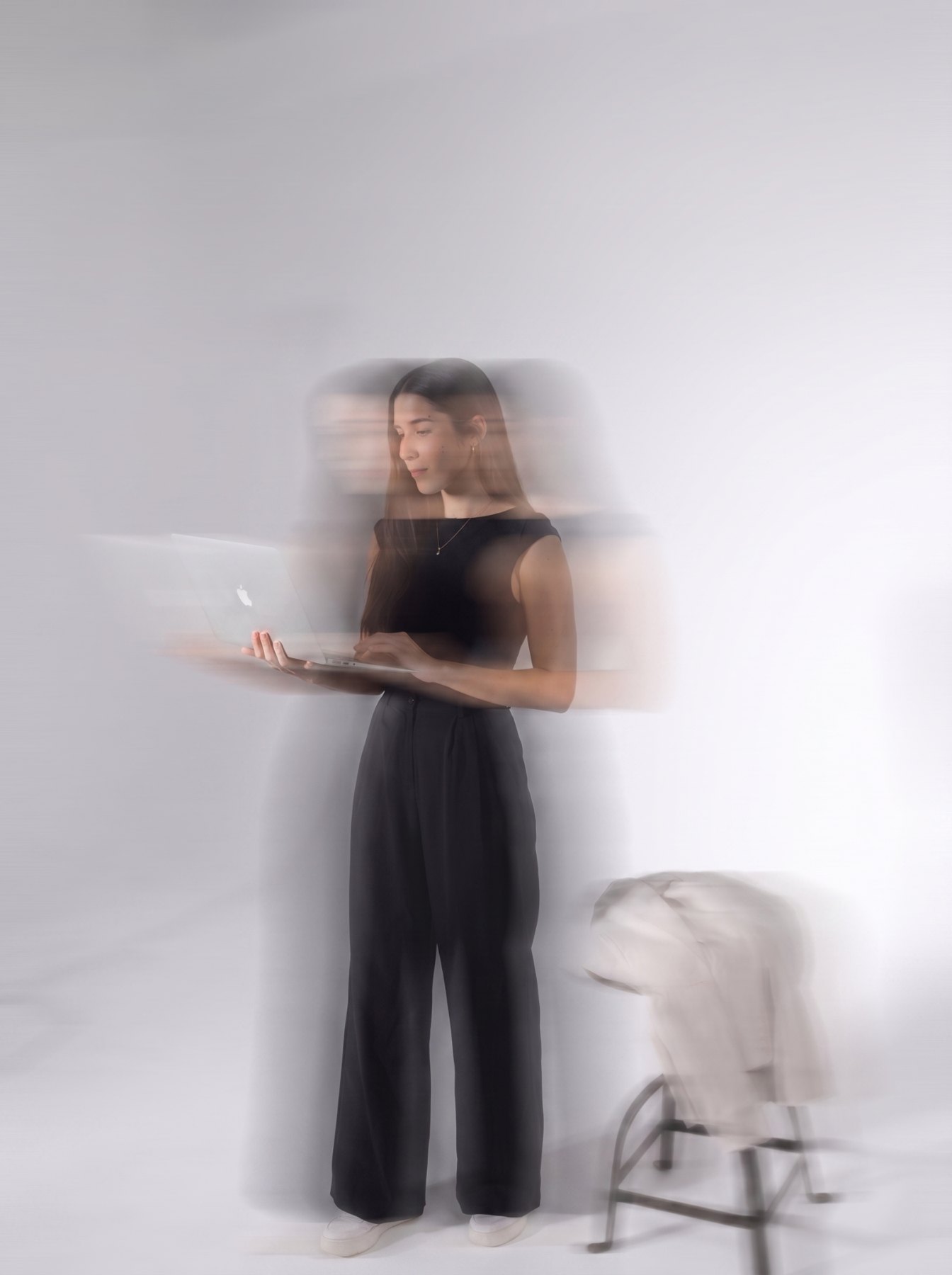 Žana working on a laptop